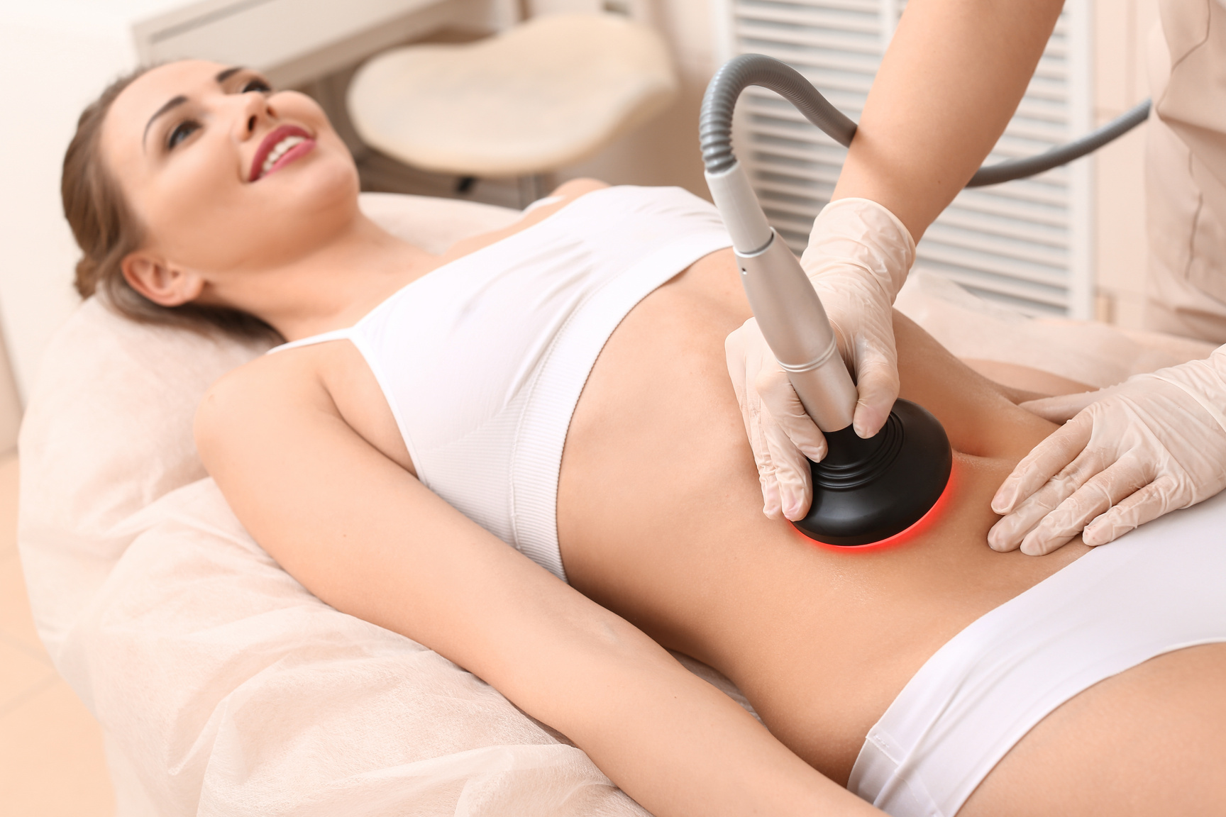 Woman Undergoing Procedure of anti-Cellulite Massage